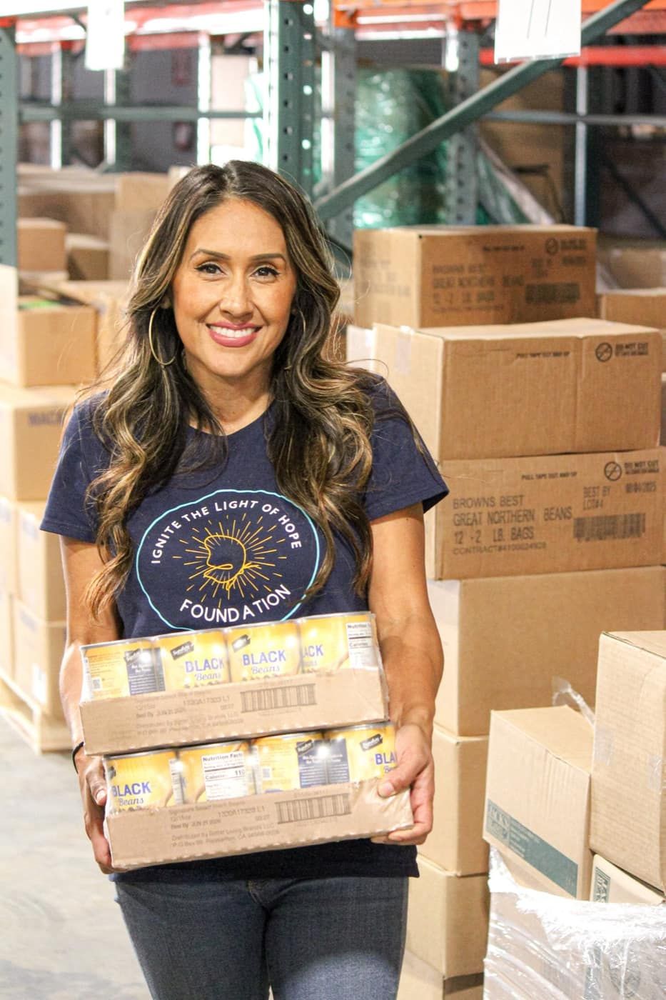 Volunteer sorting canned goods